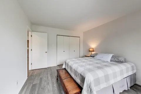 a bedroom with a bed and a closet