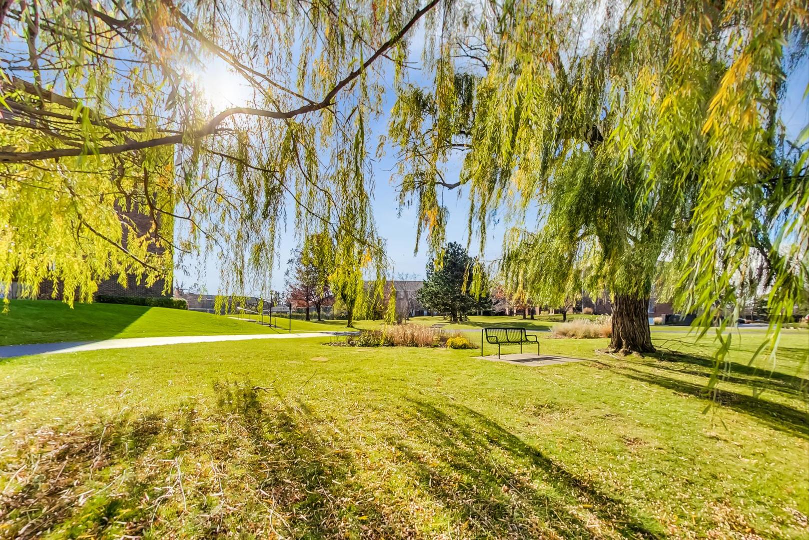 805 Leicester Road, Unit B105 Elk Grove Village, IL 60007 - Photo 28 of 37 a view of swimming pool with an outdoor space and seating area