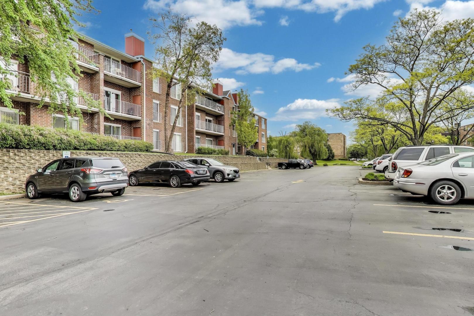 805 Leicester Road, Unit B105 Elk Grove Village, IL 60007 - Photo 34 of 37 a car parked on the side of a street