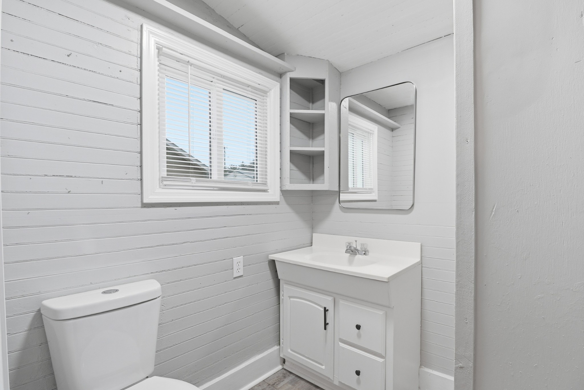 612 Maple Street Manchester, TN 37355 - Photo 13 of 20 a bathroom with a sink a toilet and mirror