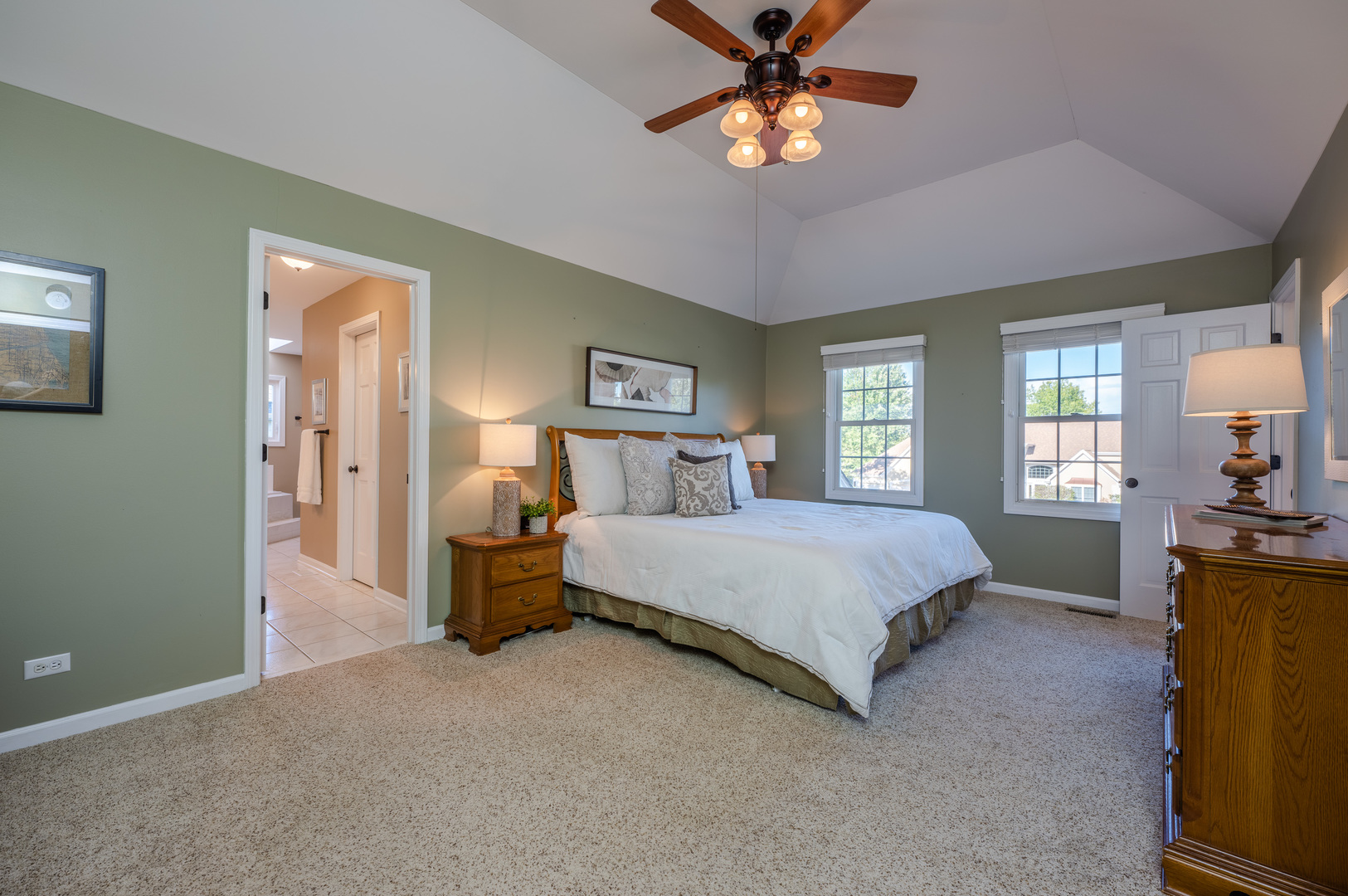 2004 Eldorado Drive Geneva, IL 60134 - Photo 13 of 26 a spacious bedroom with a bed and a chandelier