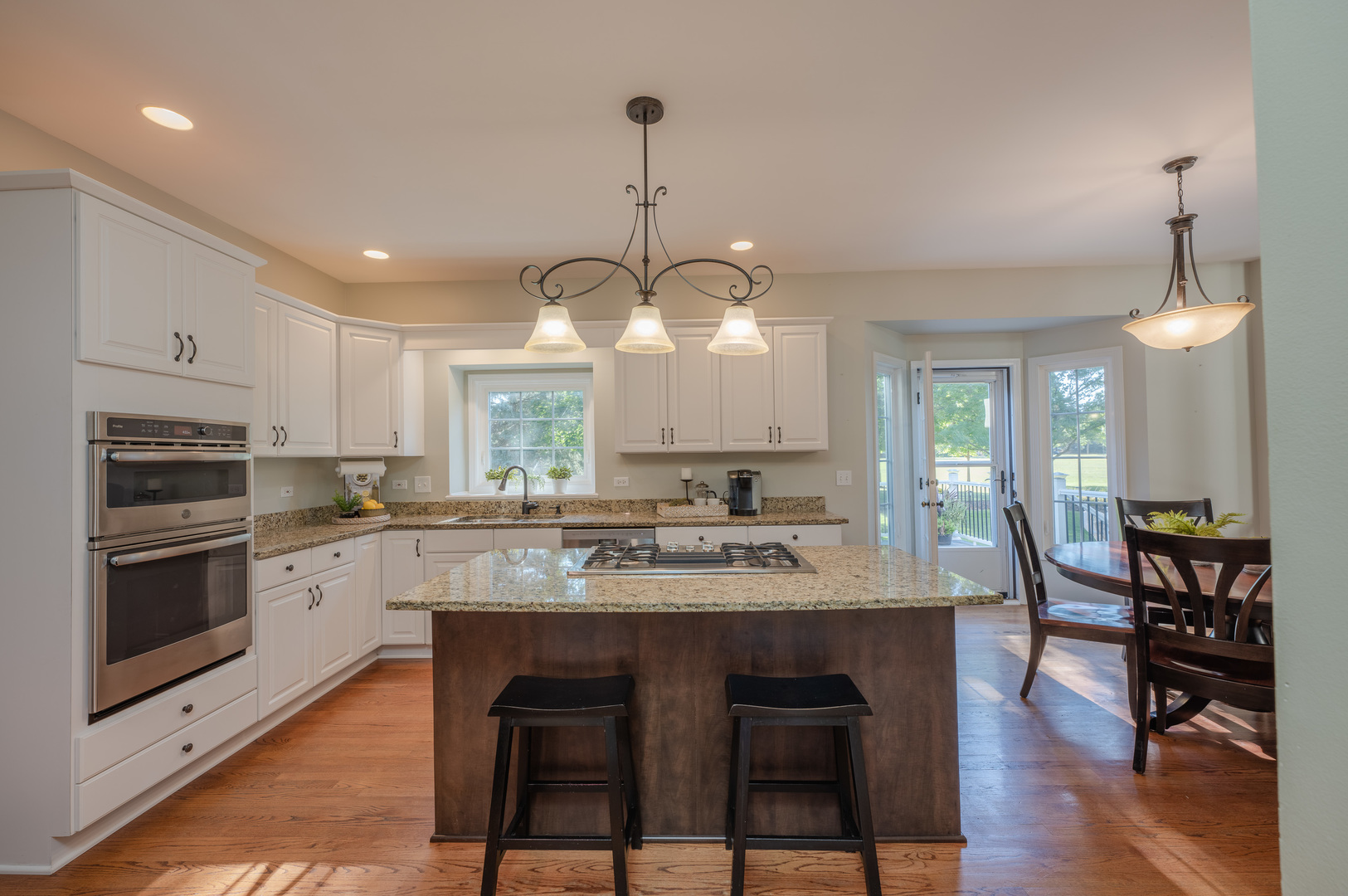 2004 Eldorado Drive Geneva, IL 60134 - Photo 5 of 26 a kitchen with center island table and chairs in it