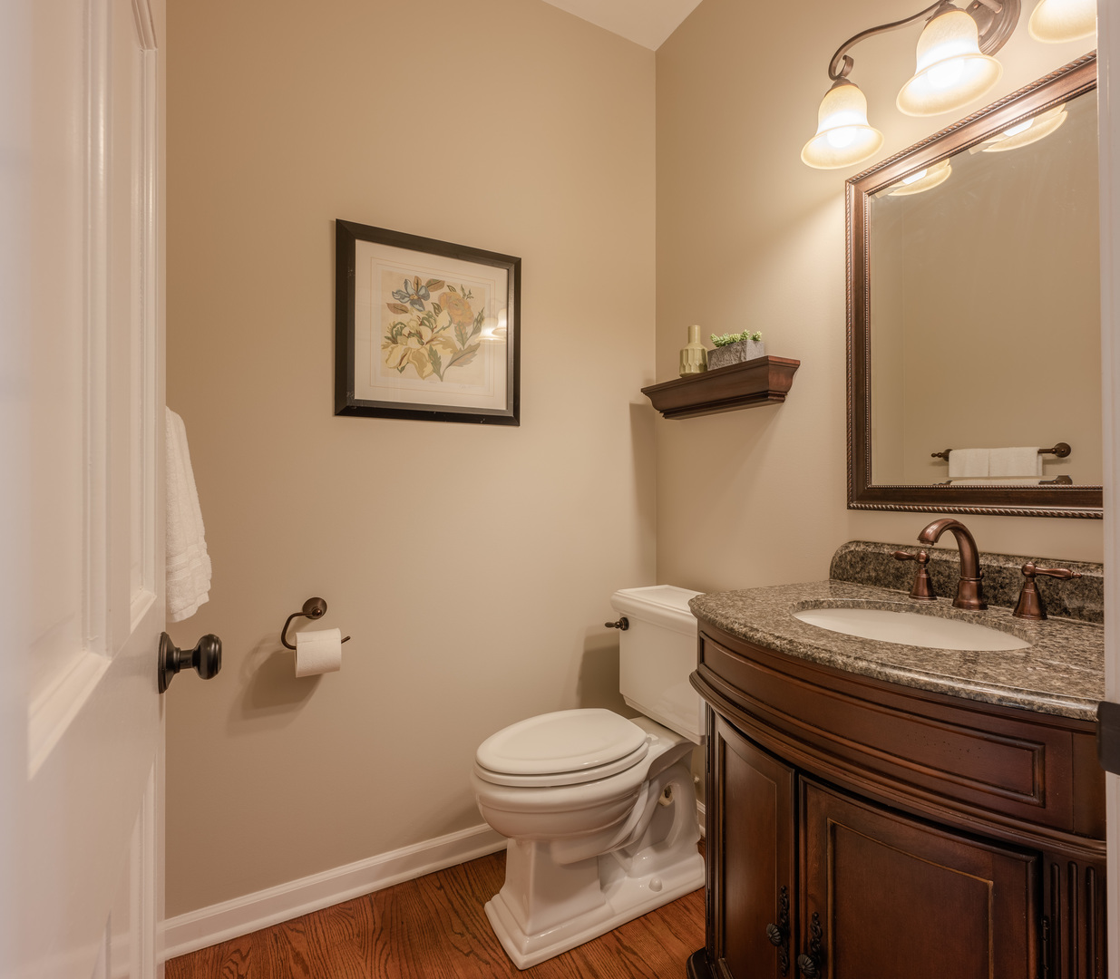 2004 Eldorado Drive Geneva, IL 60134 - Photo 10 of 26 a bathroom with a granite countertop toilet sink and mirror