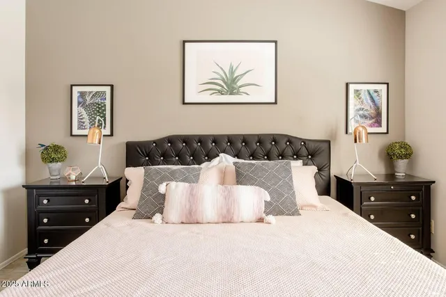 a bedroom with a bed and a dresser