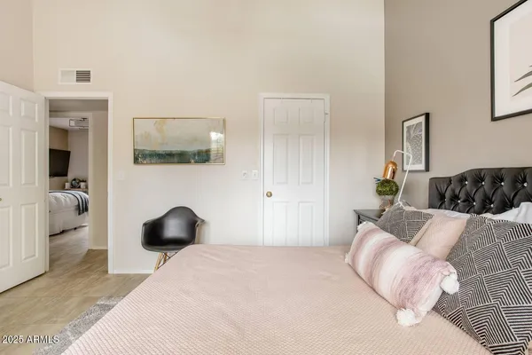 a bedroom with a bed and couch