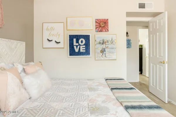 a bedroom with a bed and a couch