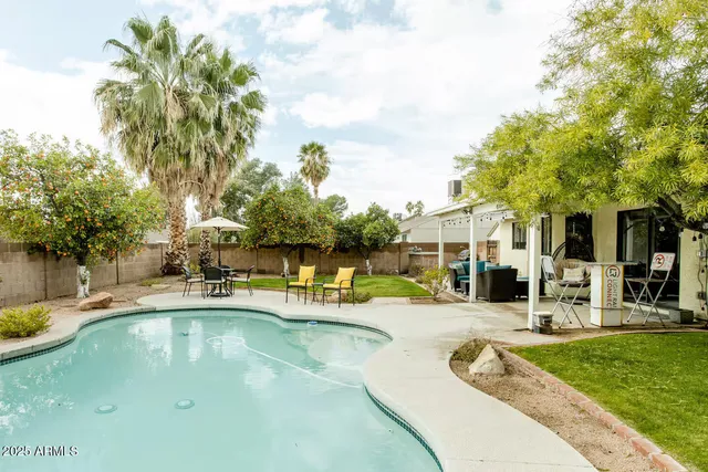 a view of a swimming pool with a patio
