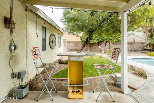 a view of a swimming pool with a patio