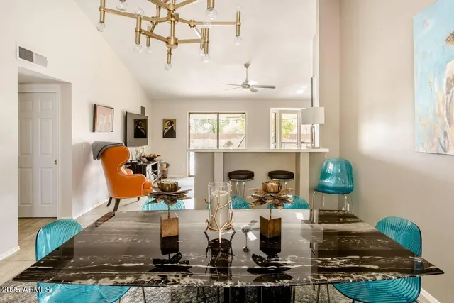 a living room with fireplace furniture and a window