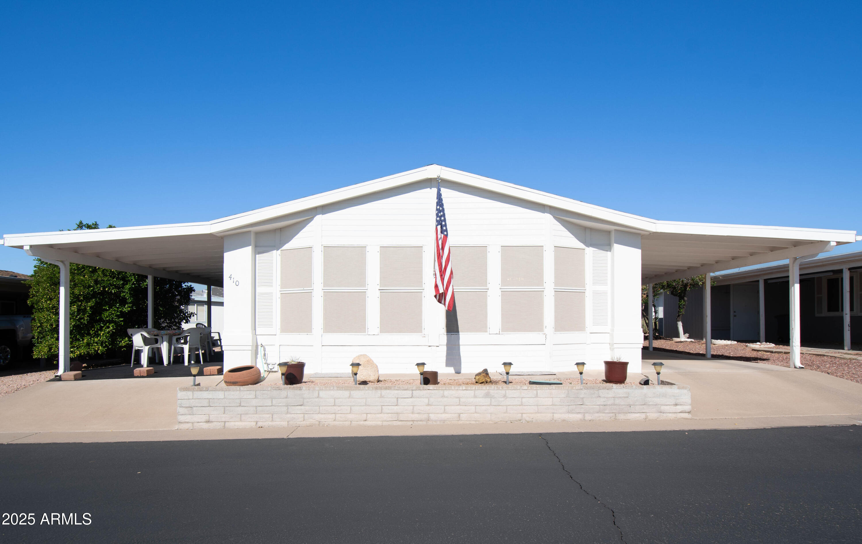 5735 East McDowell Road, Unit 410 Mesa, AZ 85215 - Photo 1 of 45 a view of a building with car parked