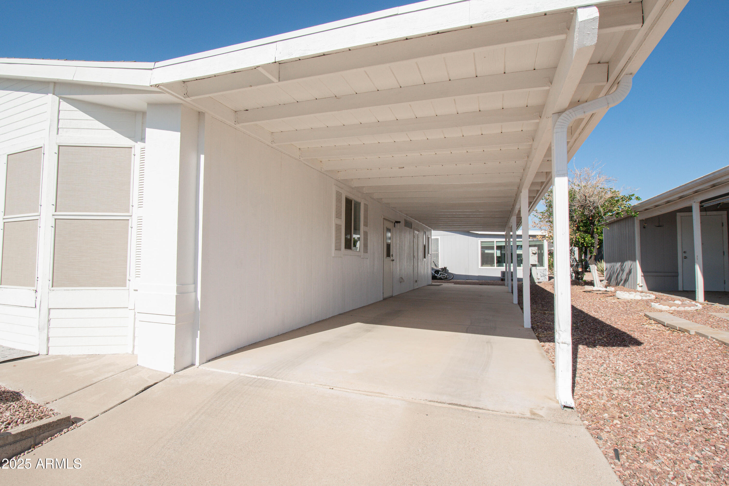 5735 East McDowell Road, Unit 410 Mesa, AZ 85215 - Photo 21 of 45 a view of a house with a patio