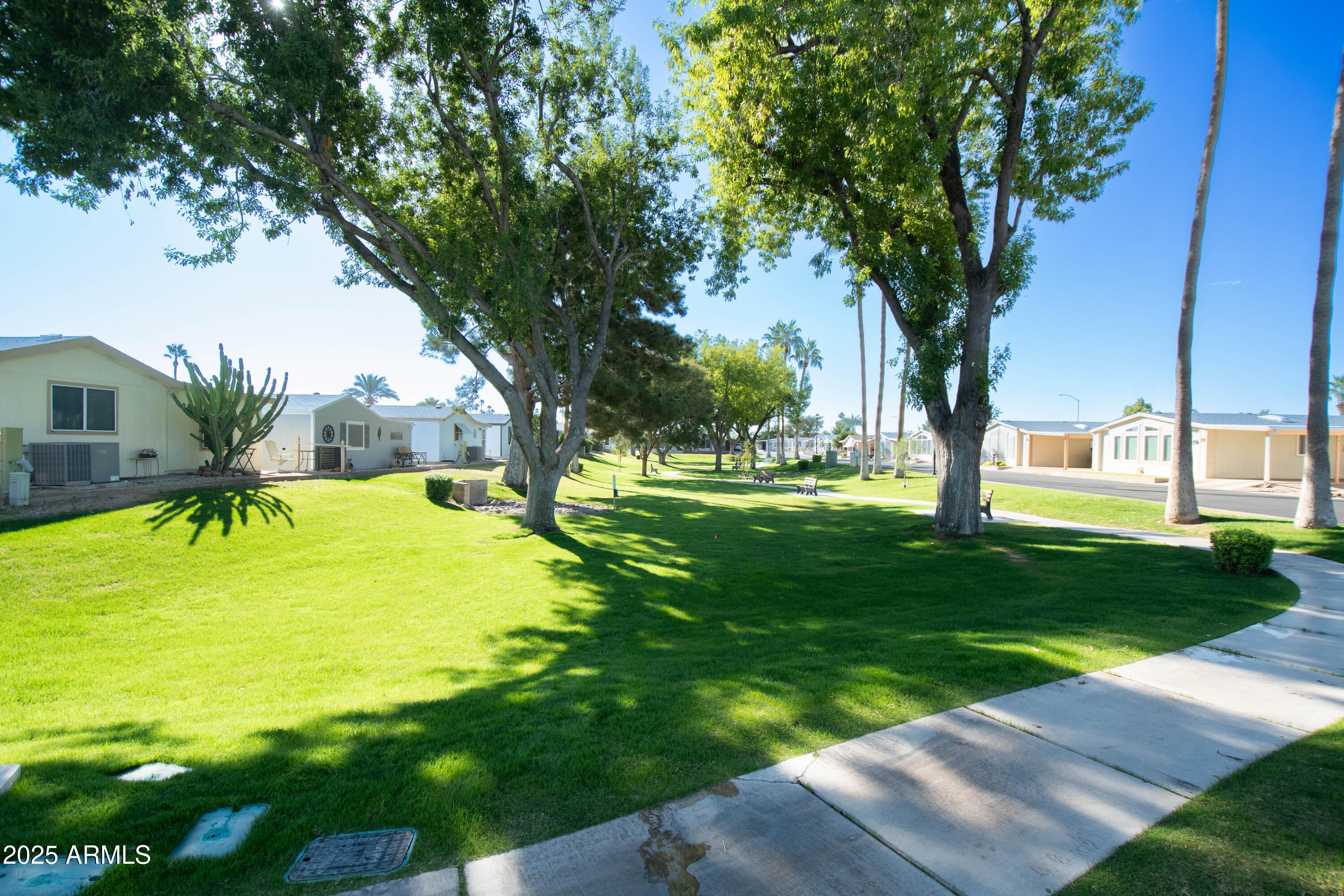 5735 East McDowell Road, Unit 410 Mesa, AZ 85215 - Photo 43 of 45 a view of a swimming pool with a yard