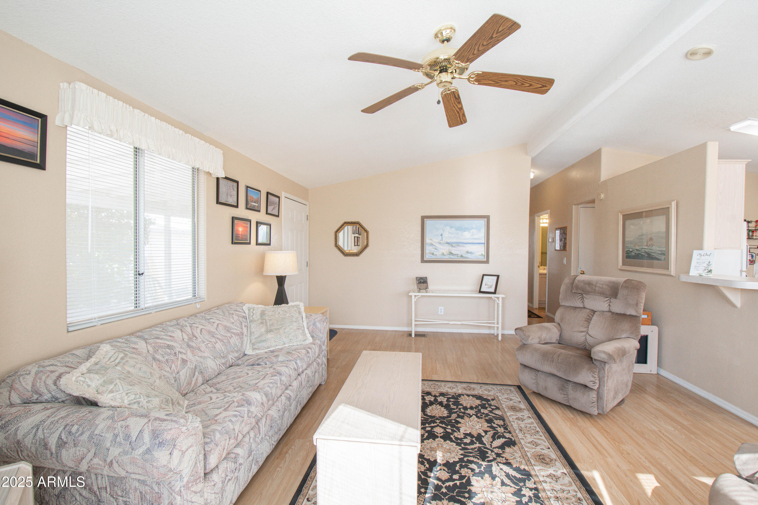 5735 East McDowell Road, Unit 410 Mesa, AZ 85215 - Photo 5 of 45 a living room with furniture and a couch