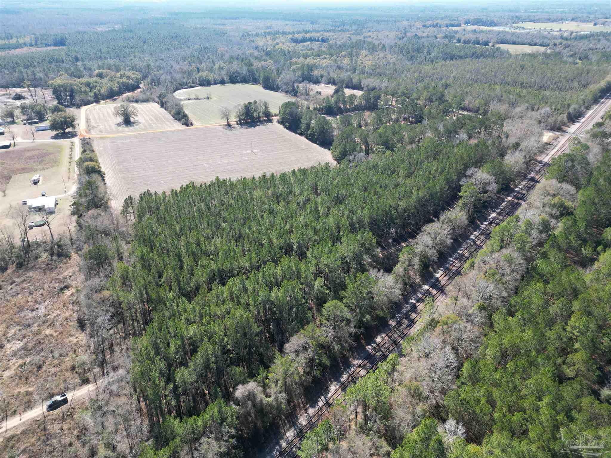 1 Clifton Lane Flomaton, AL 36441 - Photo 3 of 7 an aerial view of a house with yard and outdoor seating