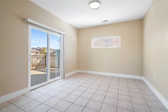 a view of an empty room and window