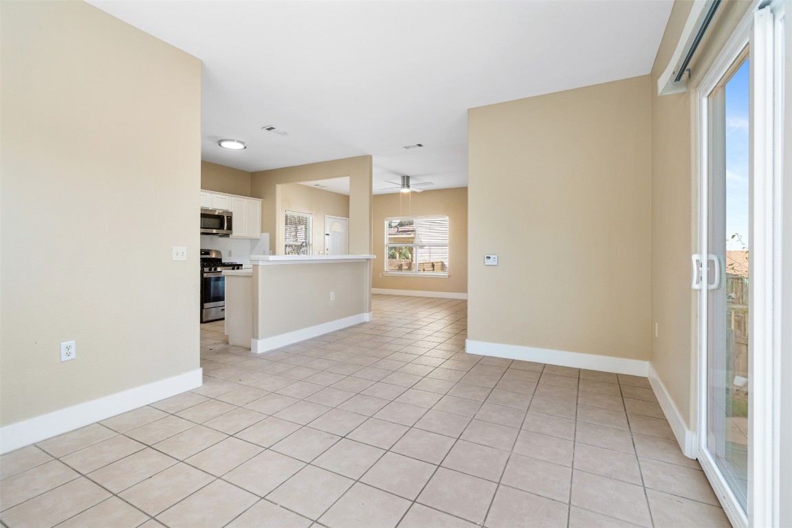 5909 Signal Point Austin, TX 78724 - Photo 16 of 32 a view of a kitchen with white cabinets and refrigerator
