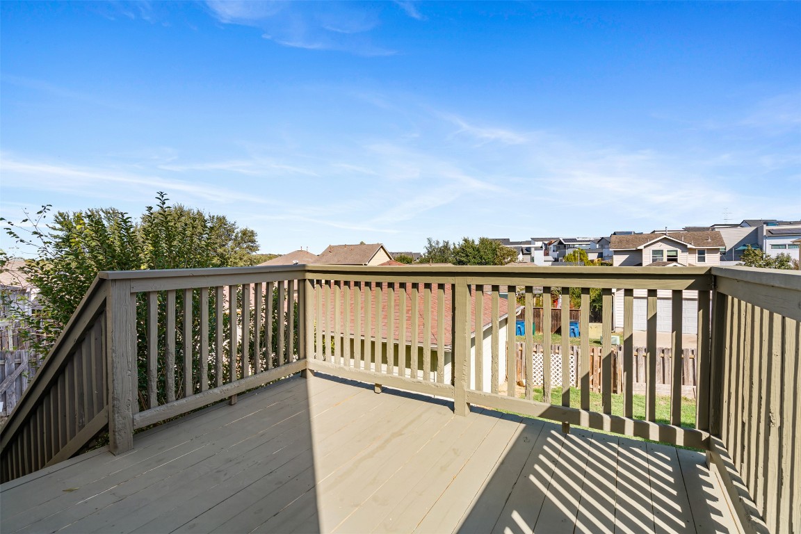 5909 Signal Point Austin, TX 78724 - Photo 18 of 32 a balcony with wooden floor and city view