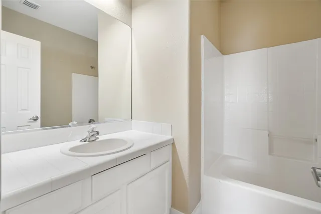 a bathroom with a sink and a bathtub