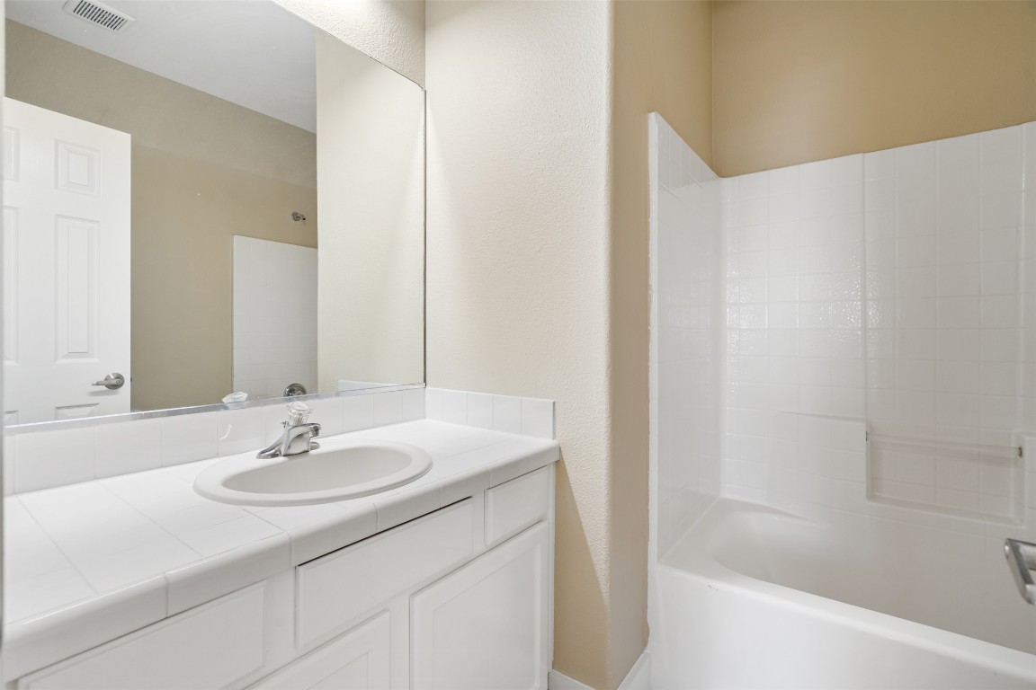 5909 Signal Point Austin, TX 78724 - Photo 30 of 32 a bathroom with a sink and a bathtub