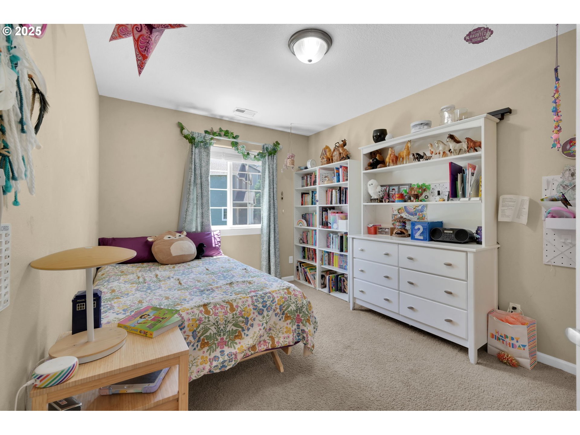 2470 Fieldcress Road Eugene, OR 97403 - Photo 28 of 36 a bedroom with a bed dresser and a window