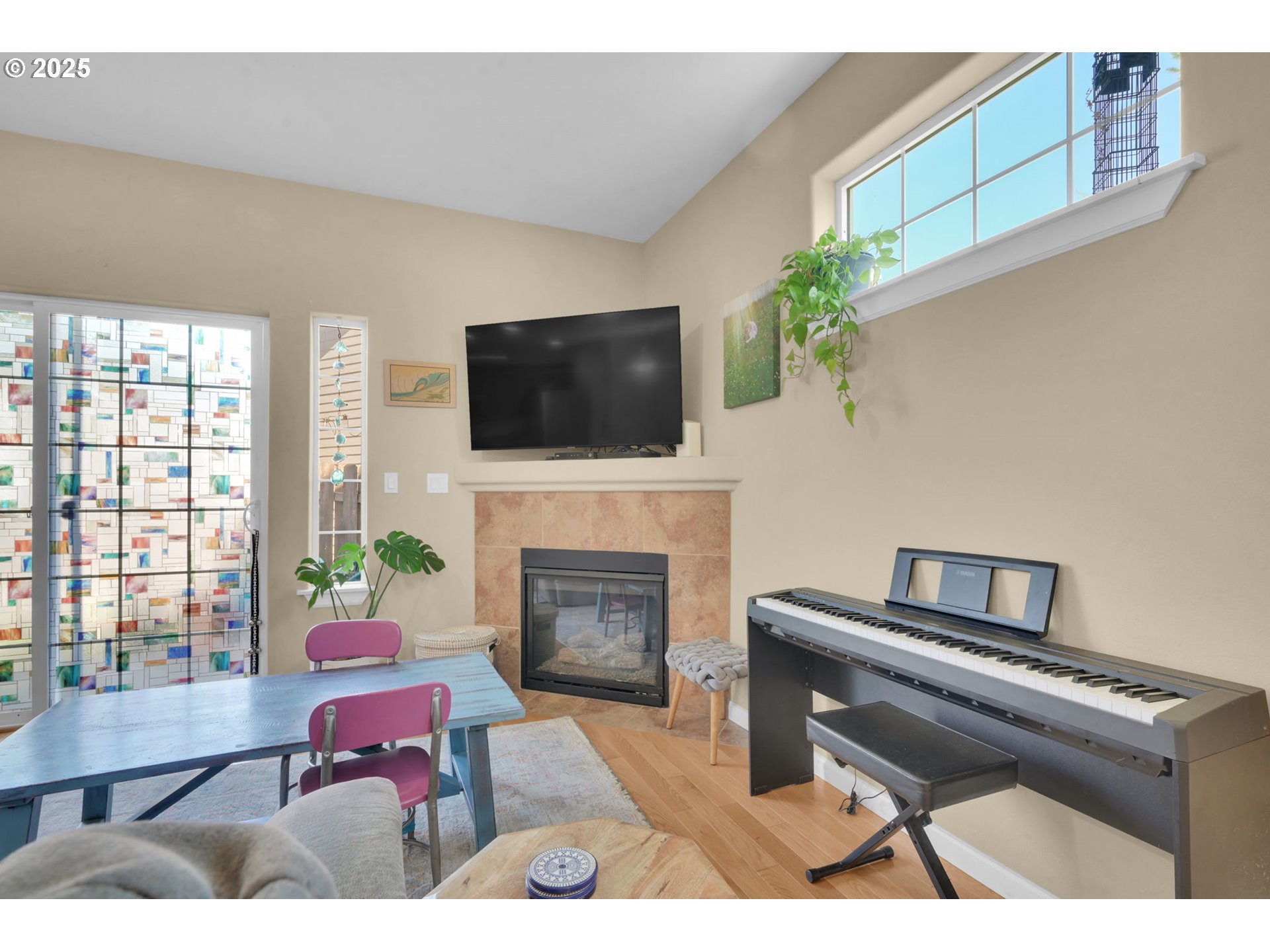 2470 Fieldcress Road Eugene, OR 97403 - Photo 7 of 36 a living room with furniture a flat screen tv and a fireplace