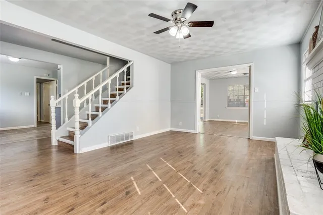a view of an entryway with wooden floor