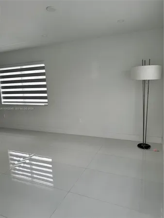 a view of empty room with a window