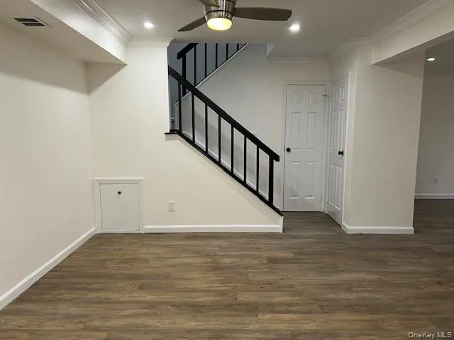 a view of an entryway with wooden floor