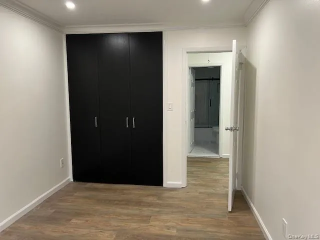 a view of hallway with wooden floor