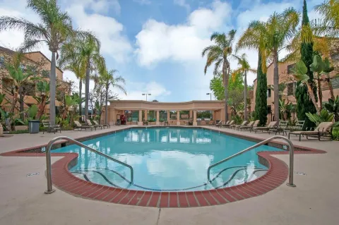 a view of a swimming pool with a yard
