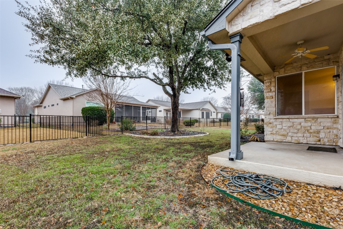 106 Prospector Pass Georgetown, TX 78633 - Photo 12 of 14 a front view of a house with garden