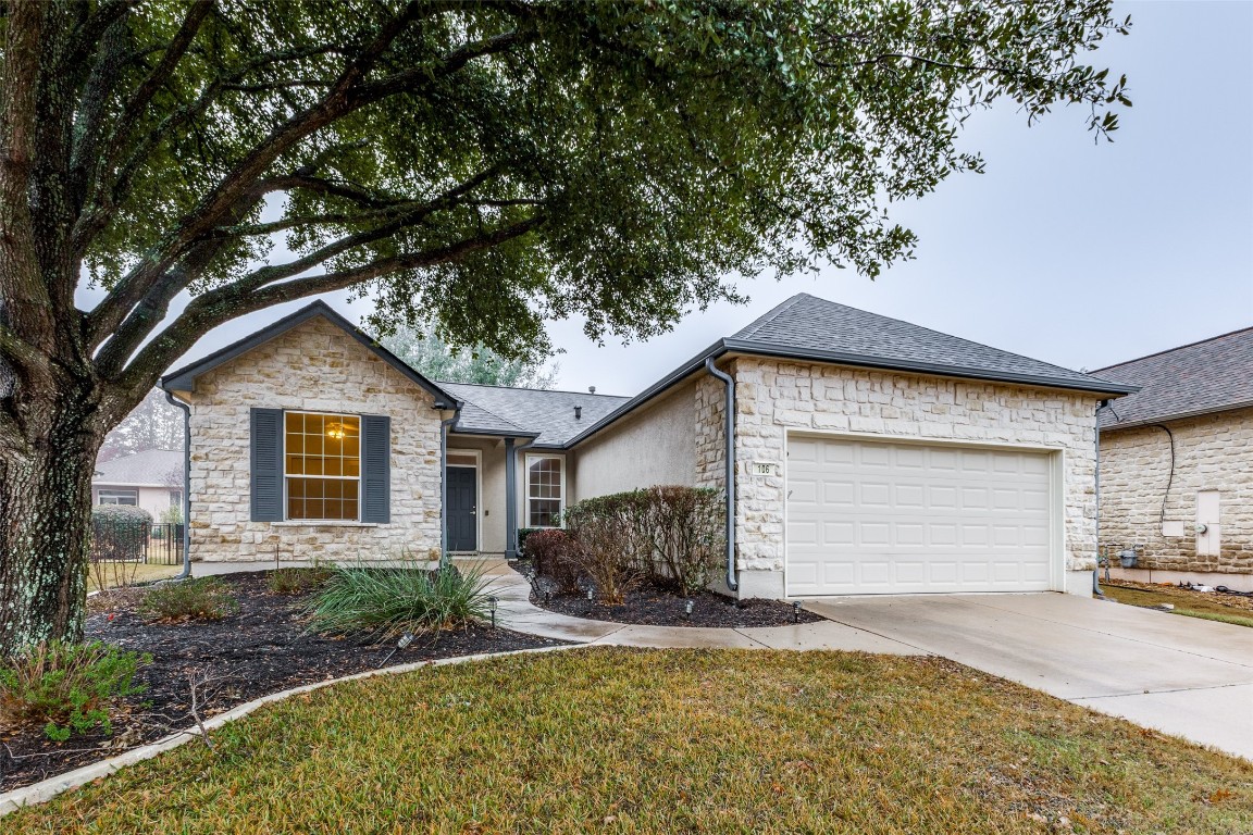 106 Prospector Pass Georgetown, TX 78633 - Photo 2 of 14 a front view of house with yard and trees