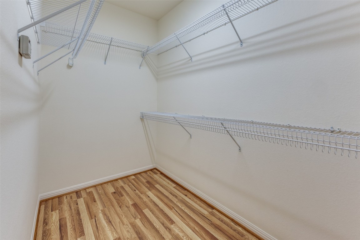 106 Prospector Pass Georgetown, TX 78633 - Photo 7 of 14 a view of a room with racks on the wall