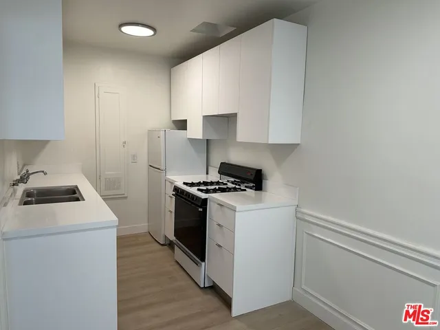 a kitchen with a stove and a microwave