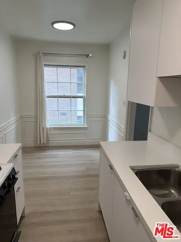 a kitchen with a stove and a sink