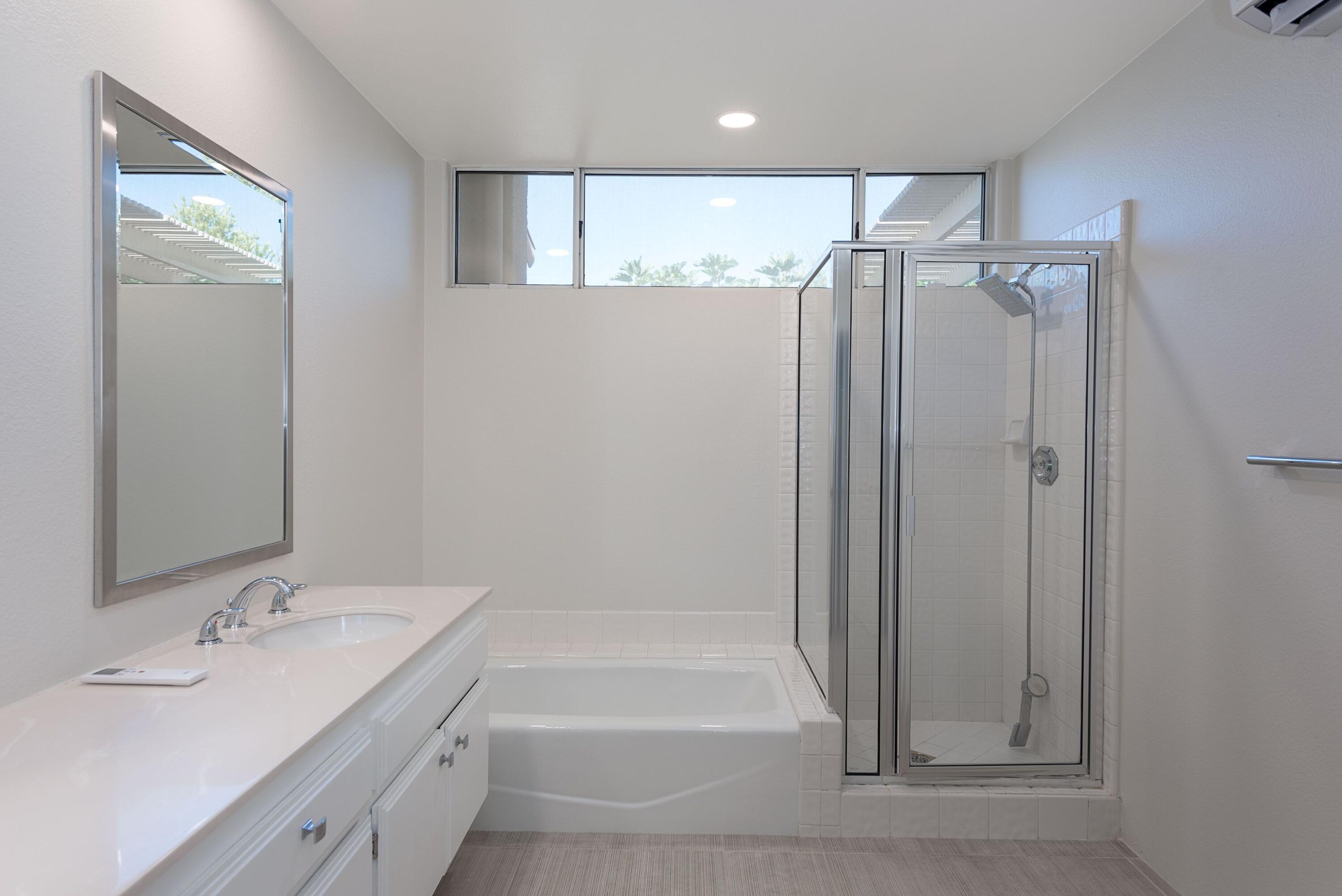 70 Pine Valley Drive Rancho Mirage, CA 92270 - Photo 14 of 31 a bathroom with a double vanity sink mirror and shower