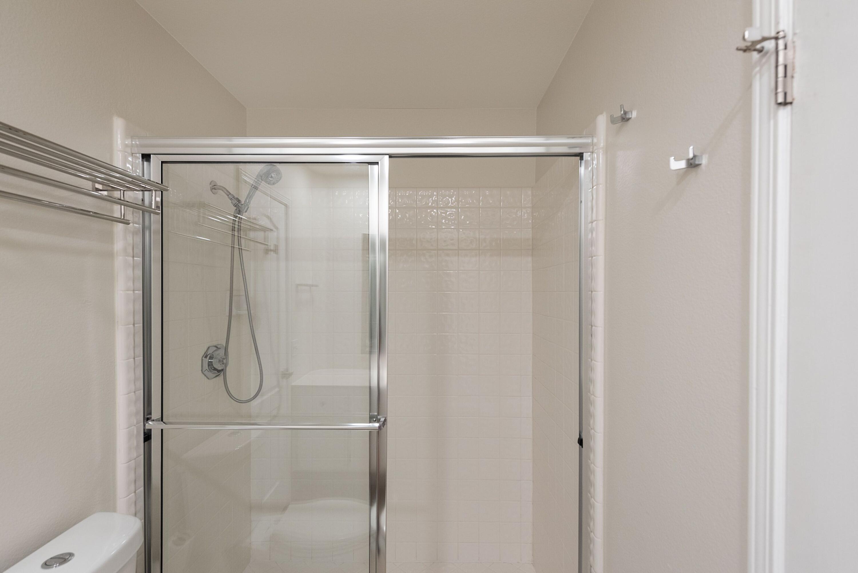 70 Pine Valley Drive Rancho Mirage, CA 92270 - Photo 16 of 31 a bathroom with a glass shower door