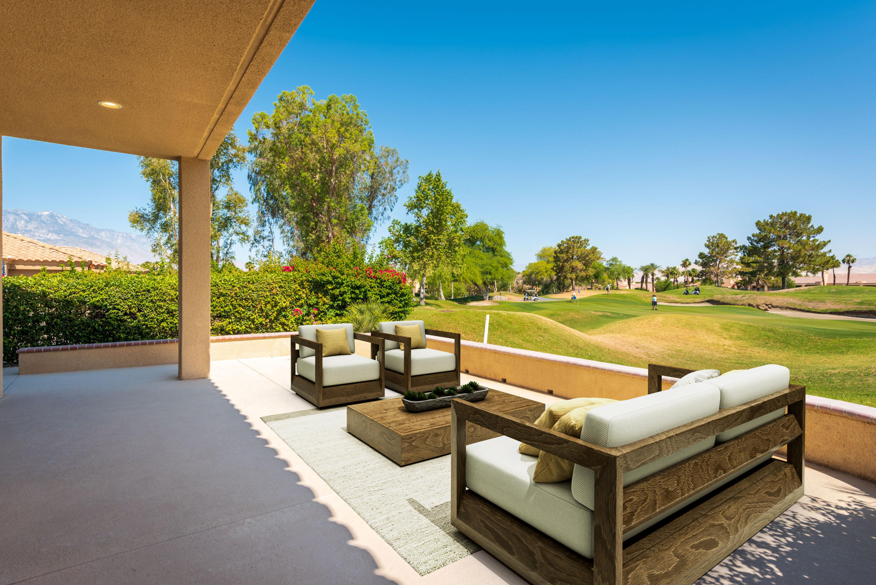 70 Pine Valley Drive Rancho Mirage, CA 92270 - Photo 20 of 31 a view of a patio with couches and table and chairs and garden
