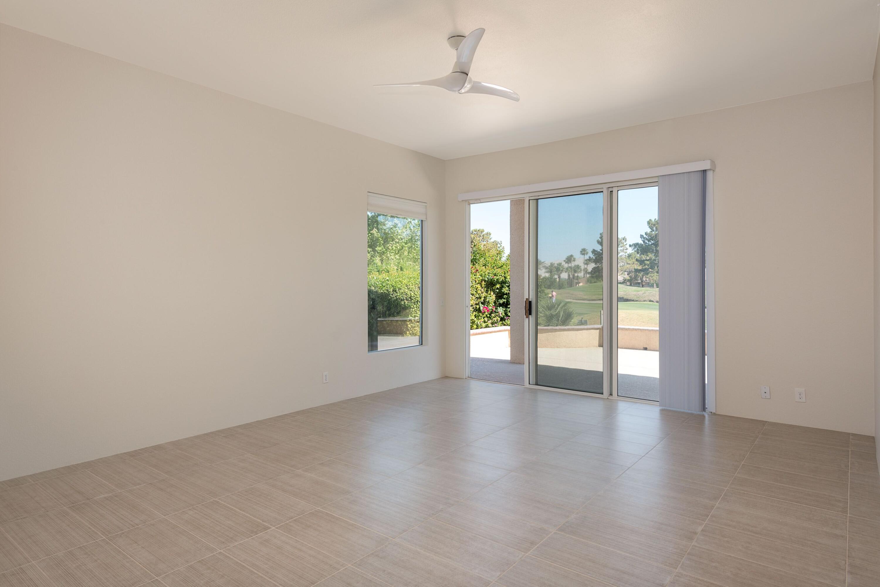 70 Pine Valley Drive Rancho Mirage, CA 92270 - Photo 7 of 31 wooden floor in an empty room with a window