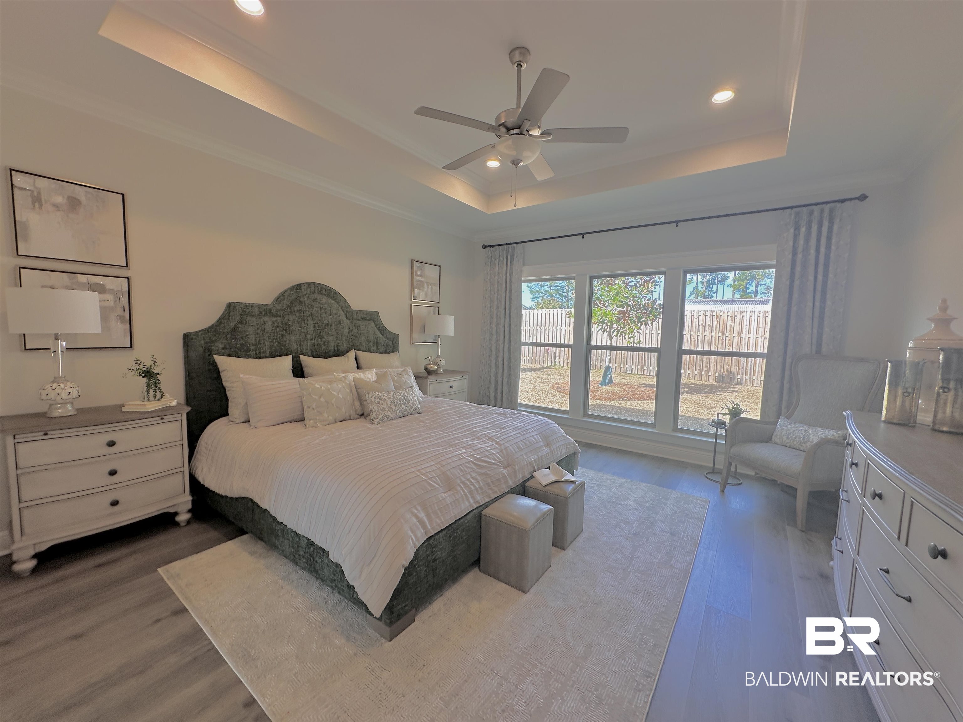 691 Kitfox Avenue Fairhope, AL 36532 - Photo 11 of 42 Bedroom with hardwood / wood-style floors, a raised ceiling, and ceiling fan