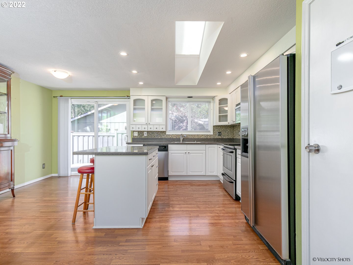 37260 Dubarko Road Sandy, OR 97055 - Photo 11 of 32 a kitchen with stainless steel appliances granite countertop a refrigerator sink and wooden cabinets
