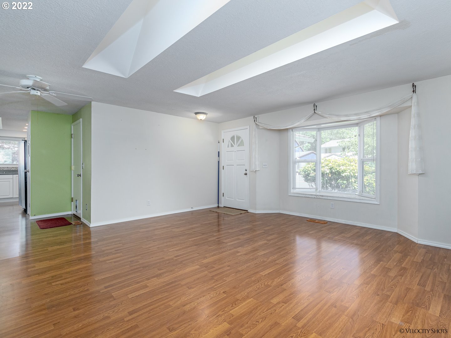 37260 Dubarko Road Sandy, OR 97055 - Photo 6 of 32 an empty room with wooden floor and windows