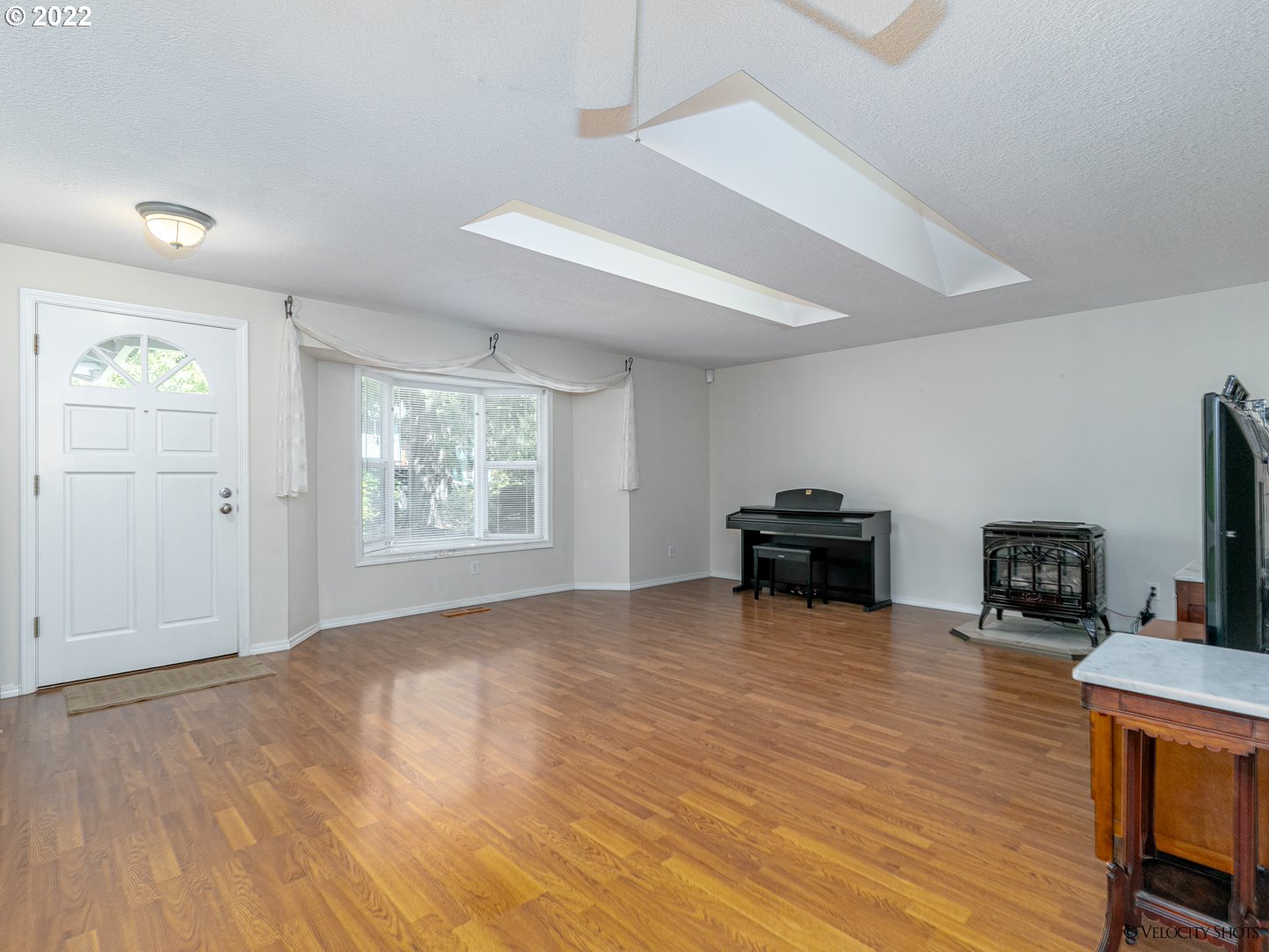 37260 Dubarko Road Sandy, OR 97055 - Photo 8 of 32 a view of a livingroom with a piano and wooden floor