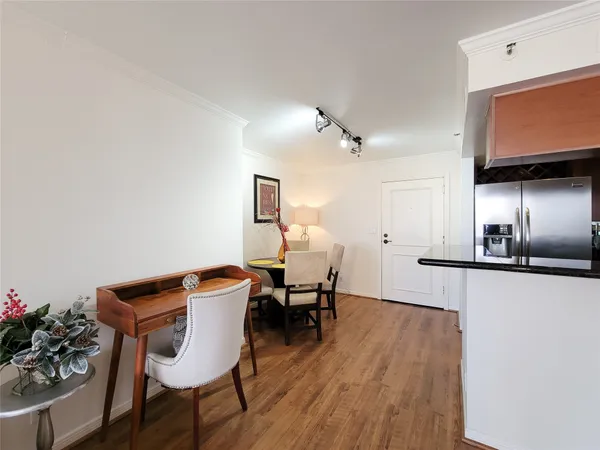 a view of a dining room with furniture and wooden floor