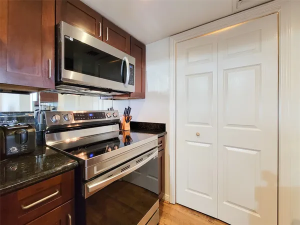 a kitchen with a stove and a microwave