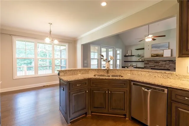 a view of backyard with large trees and wooden floor