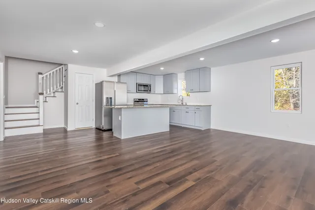 a view of kitchen with wooden floor