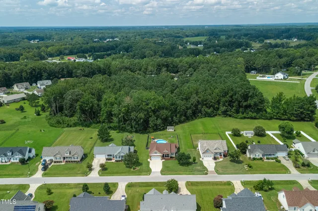 a view of a table and chairs in the garden