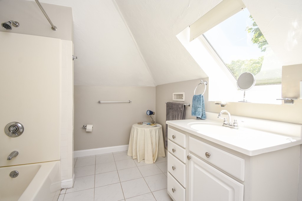 25 Wellington Street, Unit 1 Waltham, MA 02451 - Photo 12 of 18 a bathroom with a sink and a mirror