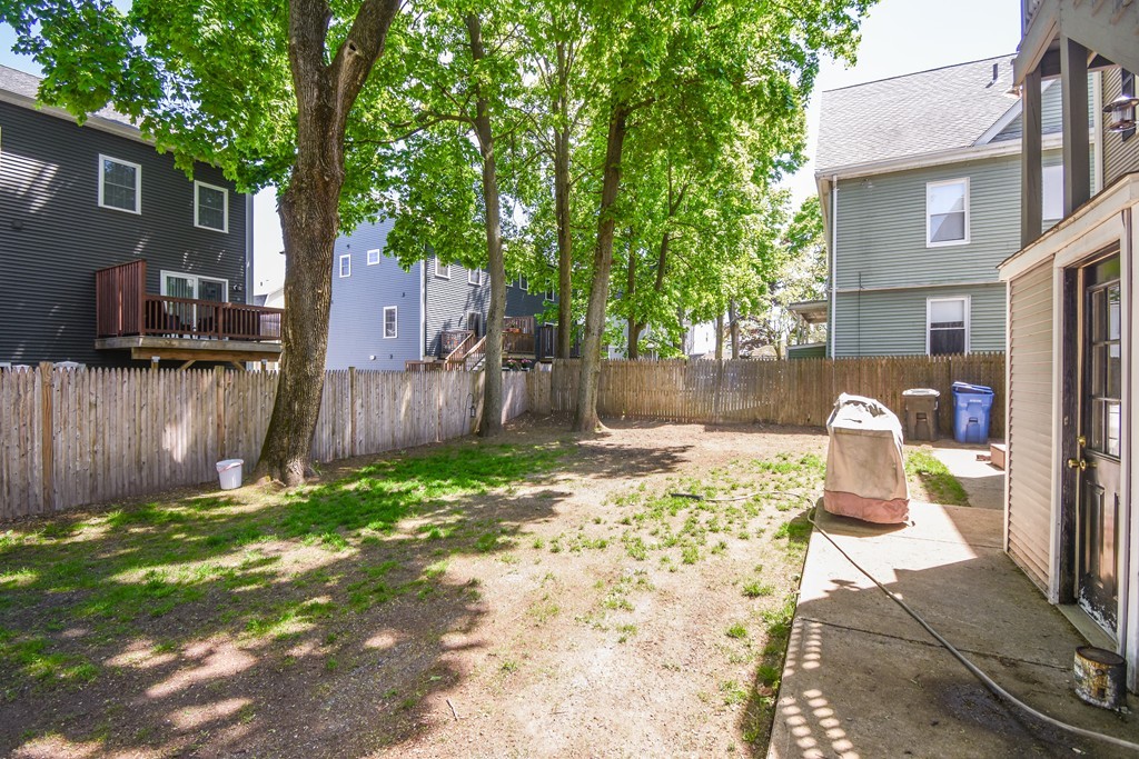 25 Wellington Street, Unit 1 Waltham, MA 02451 - Photo 3 of 18 a front view of a house with garden